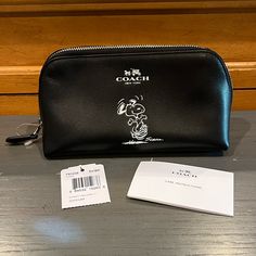 New Coach Peanuts Snoopy Black Leather Cosmetic Case Rare. Brand New, Never Used. The Tag Has Detached. Monogram Cosmetic Bag, Black Cosmetics, Canvas Leather Tote, Zipped Bag, Peanuts Snoopy, Cosmetic Pouch, Leather Wristlet, Leather Zipper, Cosmetic Case