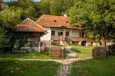 an old house with a stone path leading to it