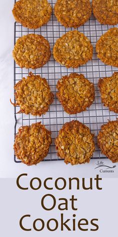 cookies cooling on a wire rack with the words coconut oat cookies above it and below