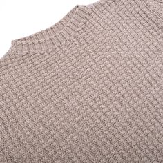 the back of a sweater that is made out of wool and knitted in beige