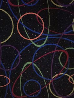 an image of colorful streamers in the dark sky with stars and circles on it