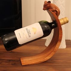 a bottle of wine on a wooden stand