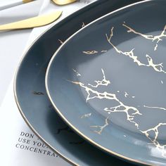 The exquisite Vernelle Collection is where art meets function. Each plate features a mesmerizing curved edge that adds a modern and artistic flair to your table setting. These stunning ceramic plates are crafted with the finest ceramic and adorned with a luxurious golden marbling design, adding a touch of elegance and sophistication to any dining experience. 12 Piece Set - 4 large plates , 4 small plates, 4 bowls 8 Piece Set - 4 large plates, 4 small plates Steak Rice Bowl, Steak Rice, New Nordic Style, Plates White, Steak Plates, Green Duvet Covers, Contour Rug, New Nordic, Luxury Bedding Set