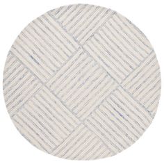 a round rug with white and blue stripes on the bottom, in front of a white background