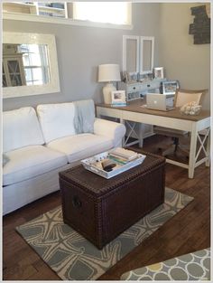 a living room filled with furniture and a coffee table