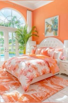 an orange and white bedroom with palm trees