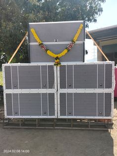 a couple of large metal gates with yellow ribbons on them