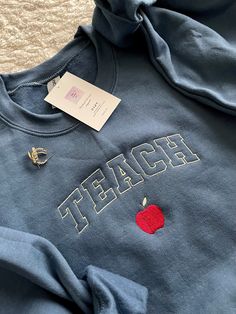 Teaching Shirts Ideas, English Teacher Aesthetic Outfits, Daycare Outfits Teachers, Teacher Embroidery Designs, Teacher Jacket, Kindergarten Teacher Outfits, Teacher Appropriate Outfits, Teach Sweatshirt