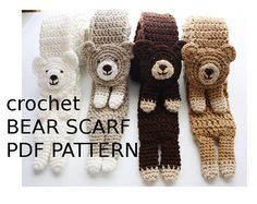 four crocheted teddy bears are lined up on a white surface, one is brown and the other is white