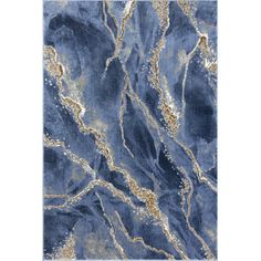 a blue rug with gold accents on the edges and an area rug that looks like marble