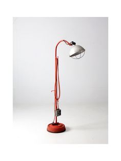 a red lamp with a white light on it