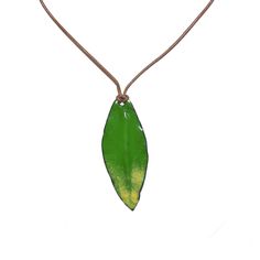 This vibrant green leaf pendant is inspired by the eucalyptus leaves that fall in my backyard. It is sure to become a go to necklace whether you wear it short or long. Lightweight and perfect for lunch on the patio or for a virtual game night. Pendant is approximately 2.5” long by 1” wide. Leather cord that adjusts from approximately 14” to 30” long (choker to opera length). Enamel torch-fired on copper. Back is similar to front. Made to order in my California studio. Ships in 2-5 days. All prod Botanical Decor, Eucalyptus Leaves, Leaf Necklace, Vibrant Green, Leaf Pendant, Green Leaf, Game Night, Cool Items, Leather Cord