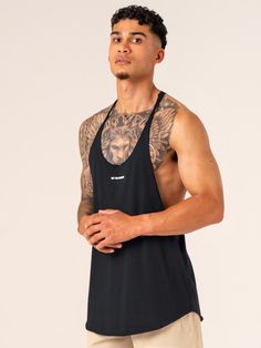 Model is 183cm tall. He usually wears a size L and is wearing a size L. His chest measures 100cm and his waist measures 83cm.
  Relaxed fit Raw cut edges Extra narrow shoulder seams Low cut armholes for freedom of movement Scooped front and back hem Woven Ryderwear label Made from a lightweight polyester blend fabric  65% Polyester/35% Cotton
Recommended for training. Black Tank T-shirt For Gym, Black Activewear With Dropped Armholes For Workout, Black Activewear For Workout With Dropped Armholes, Black Tank Muscle Tee For Sports, Black Stretch Muscle Tee For Sports, Black Stretch Muscle Tee For Gym, Black Sporty Activewear With Dropped Armholes, Black Muscle Tank For Sports, Sporty Black Activewear With Dropped Armholes