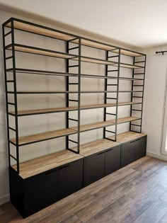 an empty room with shelves and cabinets in it