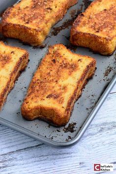 four pieces of toasted bread on a baking pan with brown sugar and seasoning