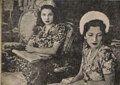 two women sitting next to each other in chairs