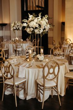 the tables are set with white and gold linens for an elegant wedding reception at the four seasons hotel