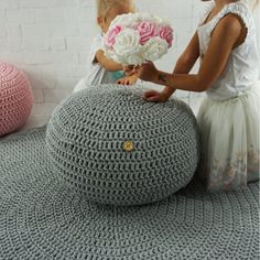 I present a beautiful, modern, crocheted pouf in the Scandinavian style. The pouf is available in 3 sizes: 33 cm wide x 25 cm high, 40 cm wide x 28 cm high, 50 cm wide x 32 cm high. A knitted pouf is an original and practical decoration of our interiors. It serves as a place to sit in the living room, bedroom, bathroom, hallway and room of your child. It also works as a footrest or can be used as a meditation pillow. Gives character to any interior. Each pouf is hand-made of cotton string with t Ottoman Nursery, Pouf Ottoman Nursery, Crochet Pouf Ottoman, Kids Bean Bag Chairs, White Nursery Decor, Scandinavian Pillows, Grey Nursery Decor, Crochet Pouf, Knitted Pouf