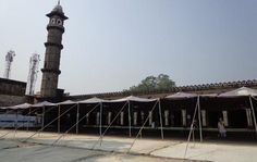 tents set up in front of an old building