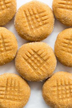 several cookies are arranged on a white surface