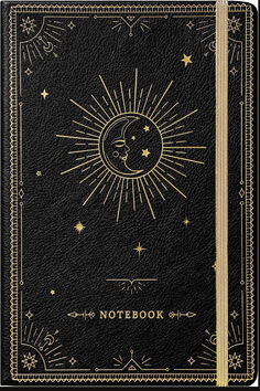 a notebook with the sun and moon in gold foil on black leather, surrounded by stars