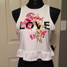 White Rose print crop top NWOT  Large White with a rose print Crop top.. Super cute , great for summer ! H&M Tops Crop Tops Print Crop Tops, Rose Print, A Rose, White Rose, Large White, White Tops, White Roses, Crop Top, Super Cute