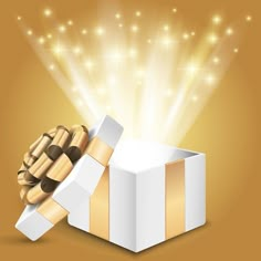 an open gift box with a gold ribbon and bow on it, in front of a golden background