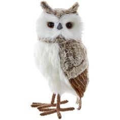 an owl stuffed animal sitting on top of a white surface