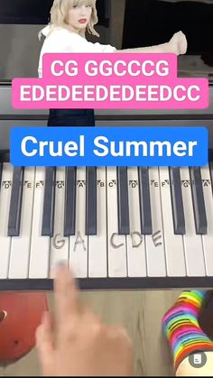 a woman standing next to a keyboard with the words cruel summer written on it in front of her