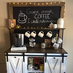 an old fashioned coffee bar is decorated with chalkboard and barn door doors as the centerpiece