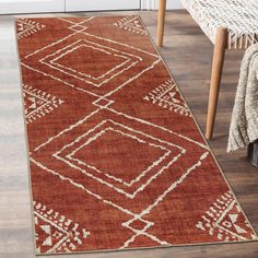 a brown and white rug in a living room