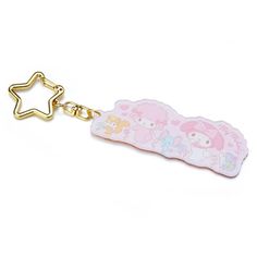 a key chain with a hello kitty design on it and a star in the middle