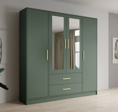 a green armoire with mirrored doors in a room