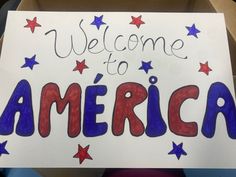 a sign with the words welcome to america written on it