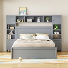 a bed sitting next to a book shelf in a bedroom