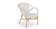 a white chair with wooden legs on a white background, it is made out of wicker