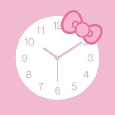 a clock with a pink bow on the face