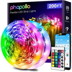 the colorful light up projector is next to a remote control and an appliance