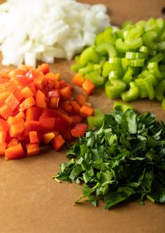 chopped up vegetables are on a cutting board