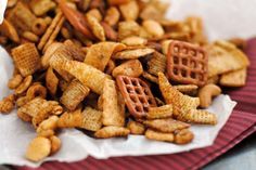 a pile of cheetos sitting on top of a red and white napkin