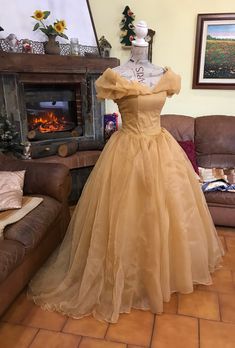 This costume is inspired by Belle's ball gown. The standard color is pale gold; if you prefer a different shade, please contact me so we can check on the availability The dress has a full skirt made of 8 layers of fabric including organza, tulle and duchesse satin; the bodice features a built-in bra and plastic boning, with a corset closure in the back. Everything will be professionally lined and finished. Measurements required are: - height - shoulders to floor (optional) - bust - waist - hips Belles Dress Beauty And The Beast, Belle Prom Dress, The Beast Costume, Belle Gown, Cotillion Dresses, Beauty And Beast Wedding, Beauty And The Beast Costume, Beast Costume, Betty Dress