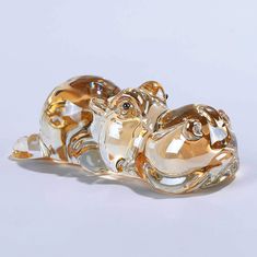 two glass animals sitting on top of each other