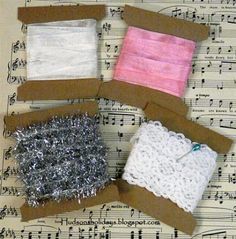 four pieces of fabric and string on top of sheet music paper with musical notes in the background