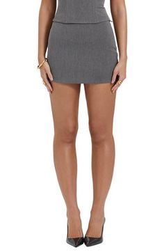 With a short length and a strikingly simple silhouette, this miniskirt expertly balances classy polish with showy intrigue. Exclusive retailer Lined 63% polyester, 33% viscose, 4% elastane Dry clean Imported Formal Mini Skirt For Summer, Chic Stretch Skort With Mini Hem, Chic Mini Skort With Stretch, Chic Fitted Denim Mini Skirt, Chic Fitted Short Skort, Chic Fitted Short Length Skort, Elegant Summer Mini Skirt, Chic Fitted Mini Skort, Elegant Lined Mini Skort