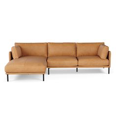 a tan leather sectional sofa with black legs