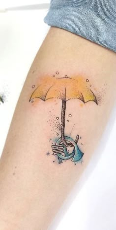 an umbrella tattoo on the left arm