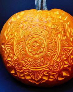 a carved pumpkin sitting on top of a blue table