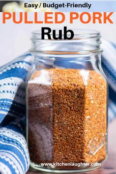 a glass jar filled with rub on top of a table