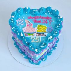 a heart shaped cake with spongebob on it