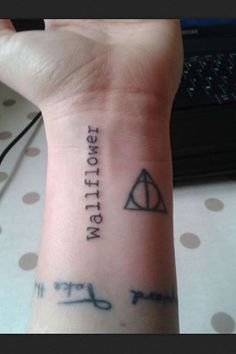 a wrist tattoo with the words harry potter and hermionery potter on it